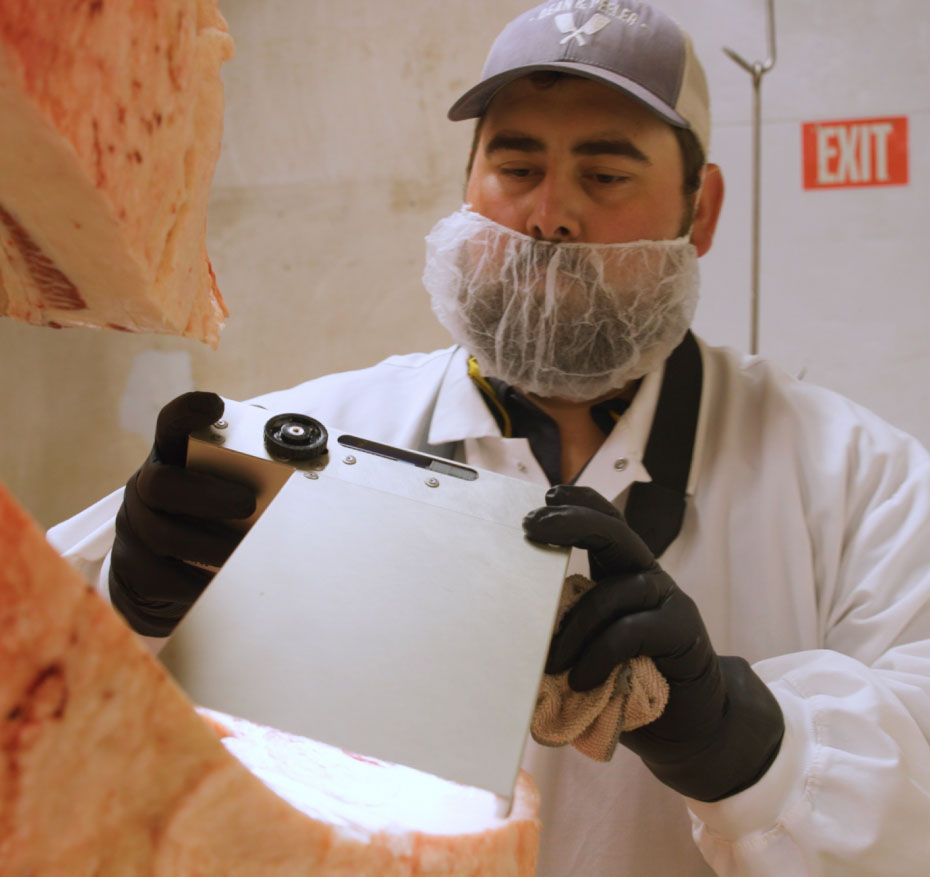 Butcher cutting meat. 
